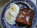  fried eggs and buttered toast 