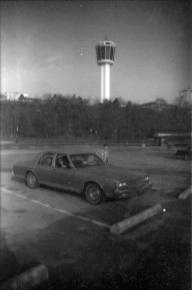 paul and people in caprice classic with minolta tower in background 