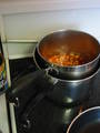  baked beans heating on stove 